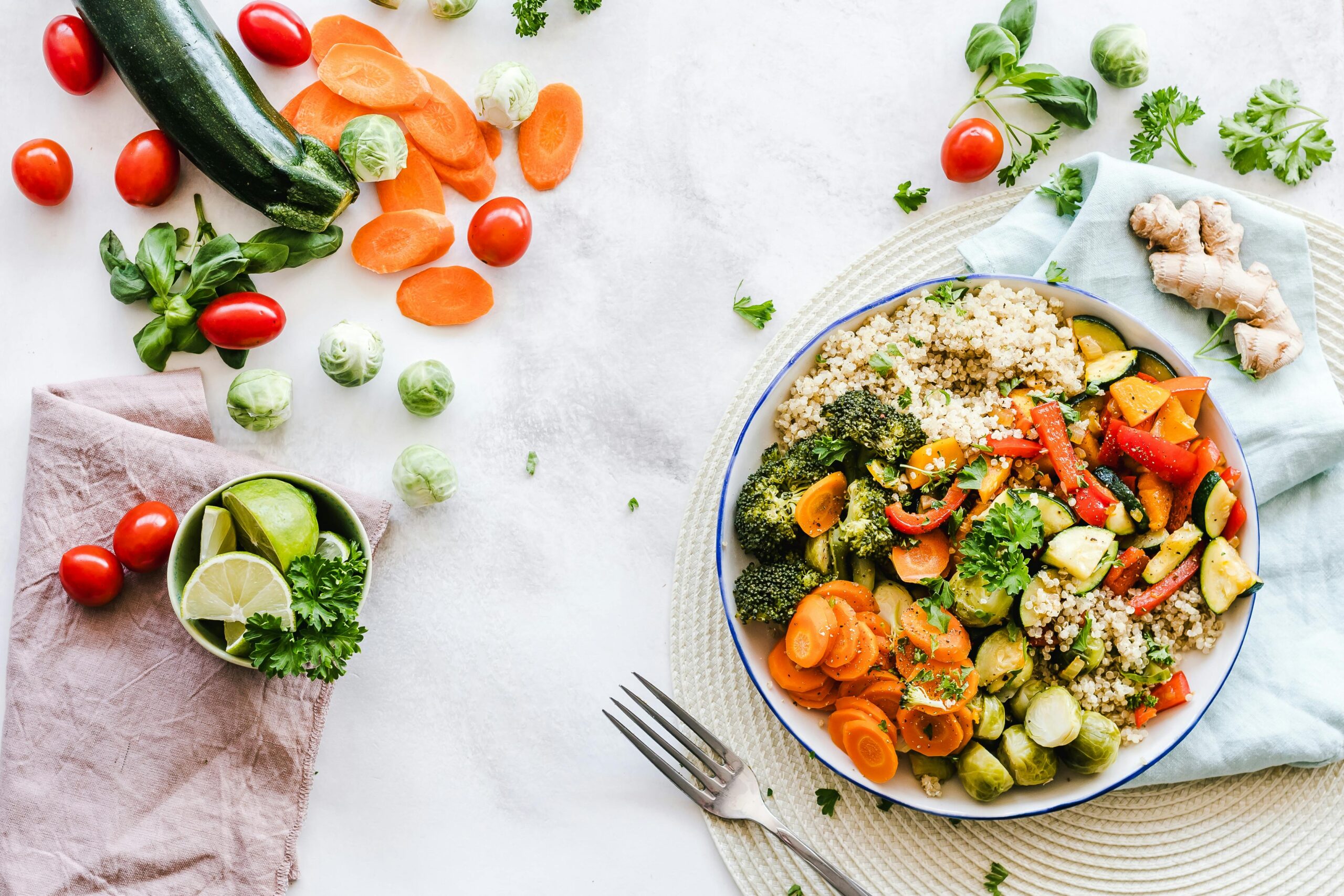 A variety of colorful fruits, vegetables, grains, and proteins on a plate, representing a balanced diet for optimal health and weight management.