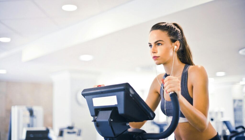 Person doing cardio exercise on a treadmill in a gym