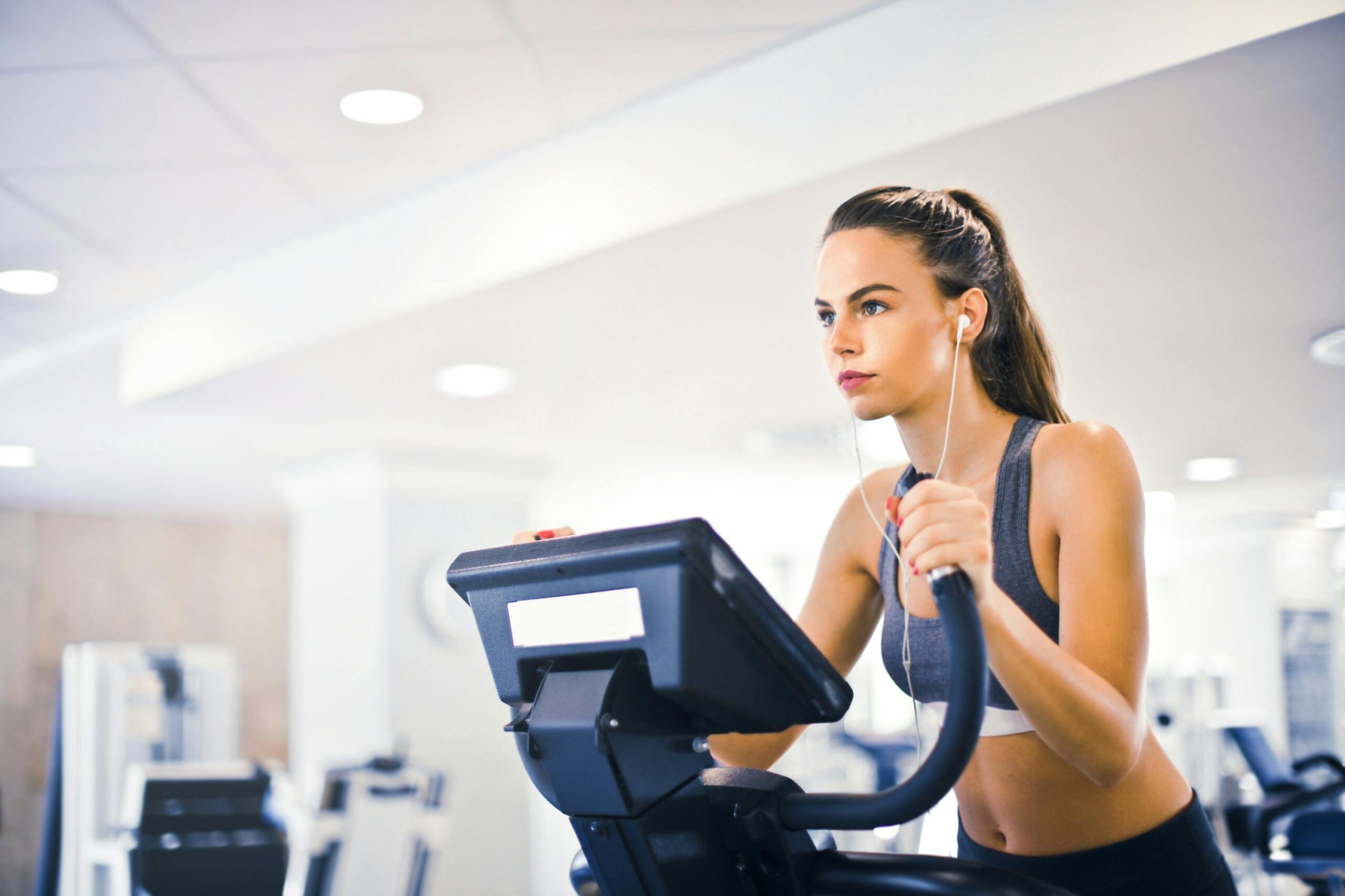 Person doing cardio exercise on a treadmill in a gym