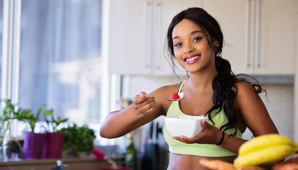 Person practicing mindful eating by savoring a fresh salad, showcasing the vibrant colors and textures of the healthy meal.